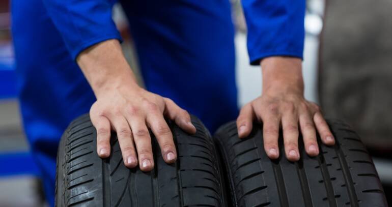 hands-mechanic-touching-tyres-1-1-1-770x407